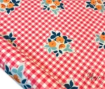 Floral Patterned Sofa and Curtain Fabric on a Red Gingham Background