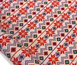 Ethnic patterned fabric decorated with winter motifs.