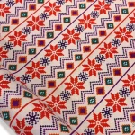 Ethnic patterned fabric decorated with winter motifs.